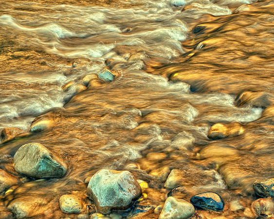 Fall color reflections in creek